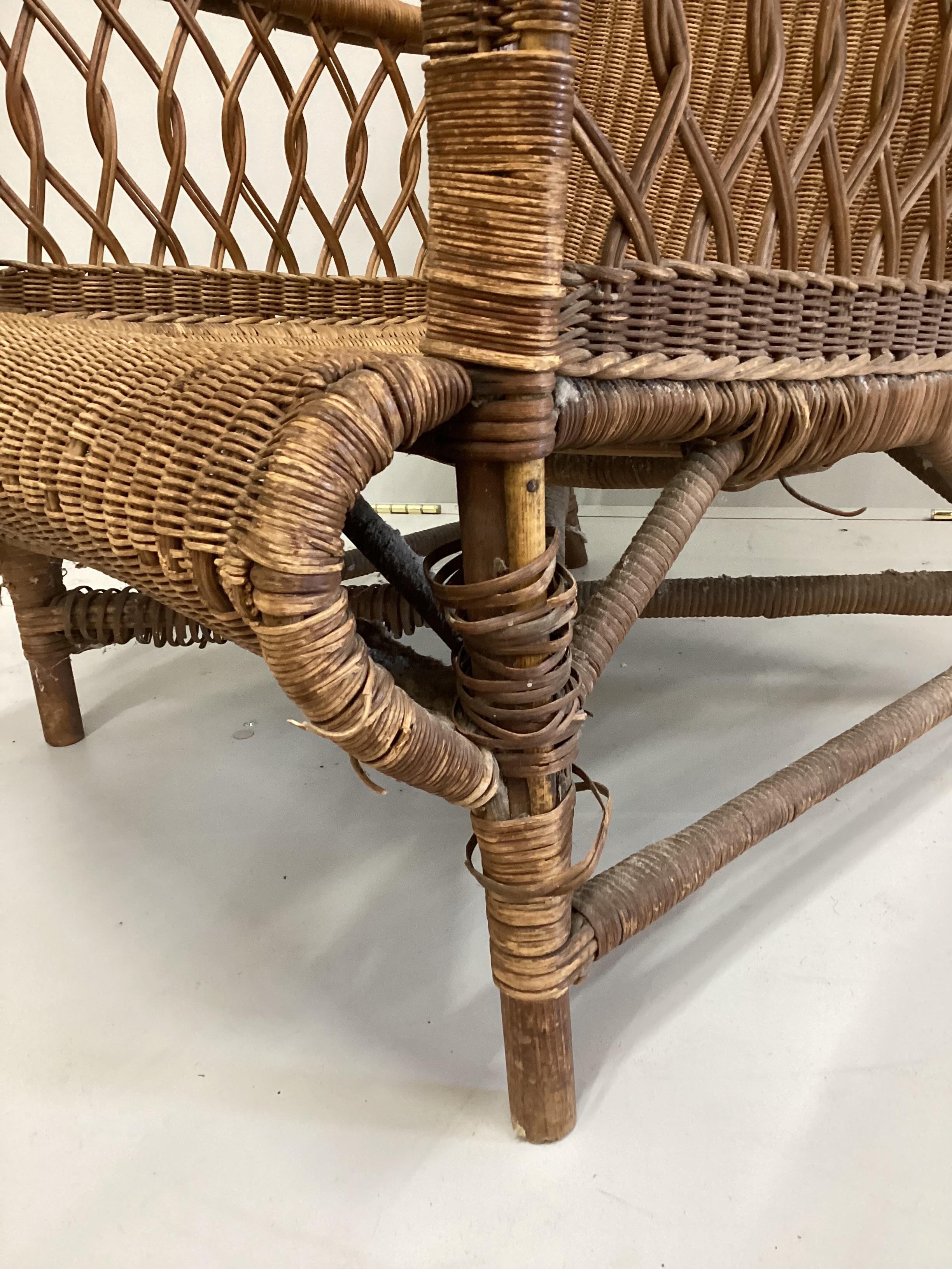 A vintage Dryad wicker elbow chair, width 67cm, depth 72cm, height 90cm